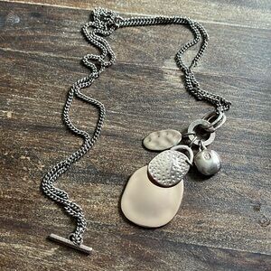 Rose gold tone long to short necklace.